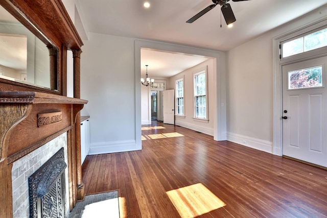 410 Emma St, Covington, KY 41011 - foyer entrance featuring hardwood / wood-style flooring, a fireplace, ceiling fan, and plenty of natural light