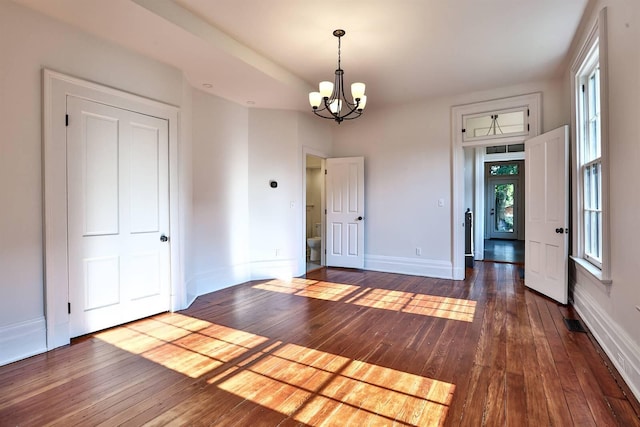 410 Emma St, Covington, KY 41011 - unfurnished dining area with a chandelier and dark wood-style floors