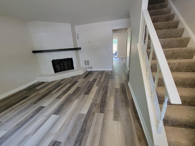 6859 Curtis Way, Florence, KY 41042 - unfurnished living room with wood finished floors, a fireplace, and stairway