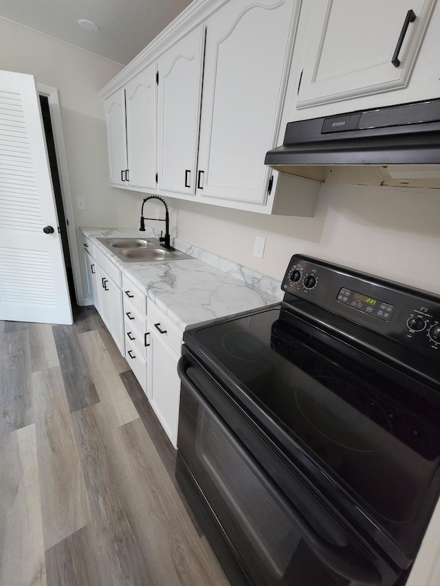 6859 Curtis Way, Florence, KY 41042 - kitchen with black / electric stove, white cabinets, dark wood-type flooring, range hood, and light stone countertops