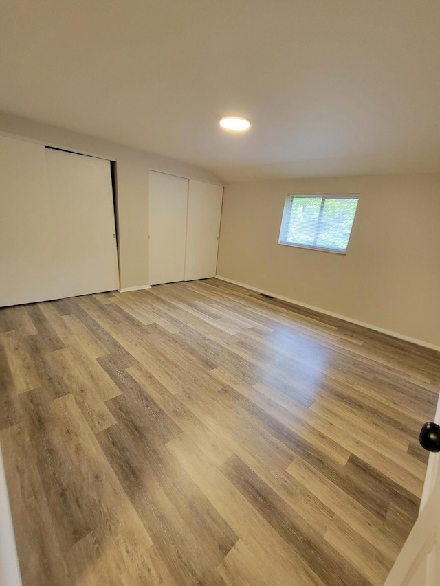 6859 Curtis Way, Florence, KY 41042 - unfurnished bedroom featuring two closets and light wood finished floors