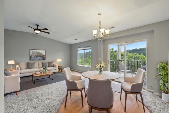 2225 Rolling Hills Dr, Covington, KY 41017 - dining room with light wood-style flooring, a chandelier, lofted ceiling, and ceiling fan