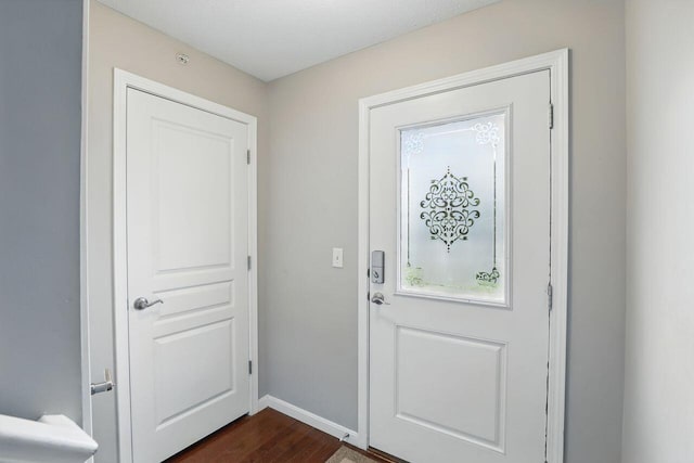 2225 Rolling Hills Dr, Covington, KY 41017 - doorway to outside with dark wood-style flooring and baseboards