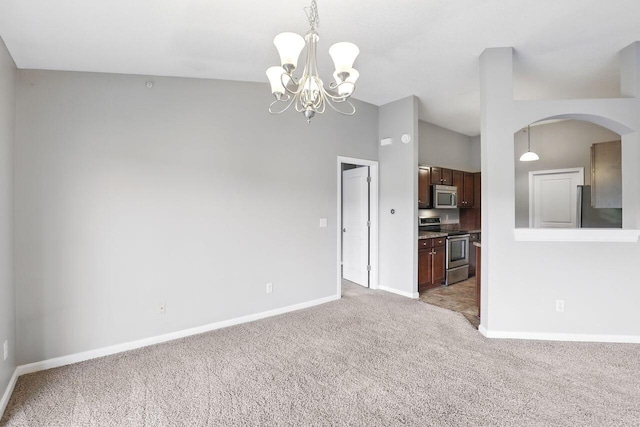 2225 Rolling Hills Dr, Covington, KY 41017 - unfurnished living room featuring light colored carpet, a chandelier, and arched walkways