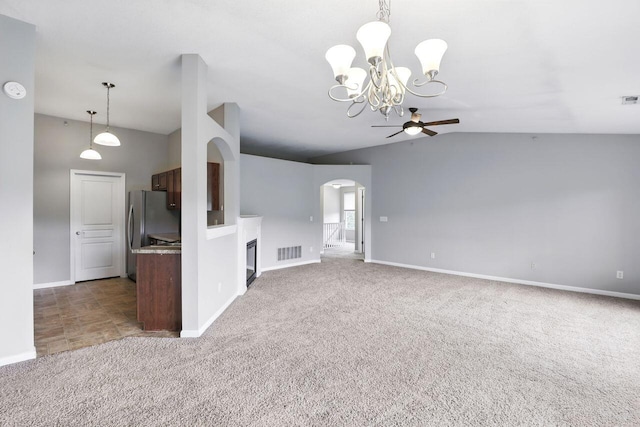 2225 Rolling Hills Dr, Covington, KY 41017 - unfurnished living room with lofted ceiling, carpet, ceiling fan, arched walkways, and a chandelier