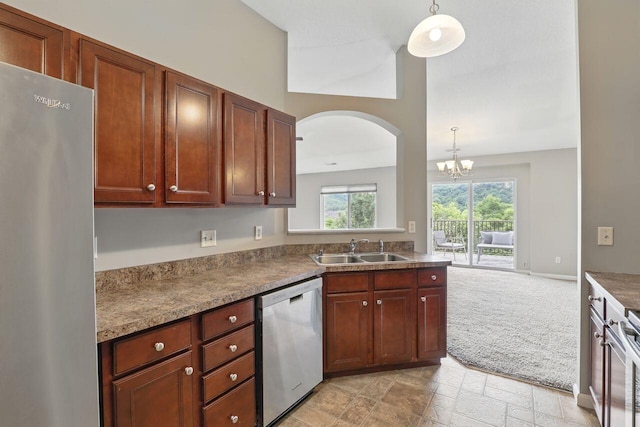 2225 Rolling Hills Dr, Covington, KY 41017 - kitchen featuring stainless steel appliances, arched walkways, a chandelier, hanging light fixtures, and light stone finish floors