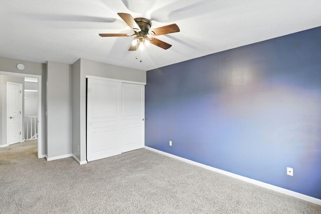 2225 Rolling Hills Dr, Covington, KY 41017 - unfurnished bedroom featuring a closet, carpet, and ceiling fan