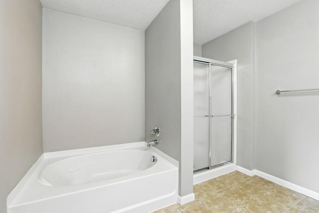 2225 Rolling Hills Dr, Covington, KY 41017 - full bath with a garden tub, a stall shower, tile patterned floors, and a textured ceiling