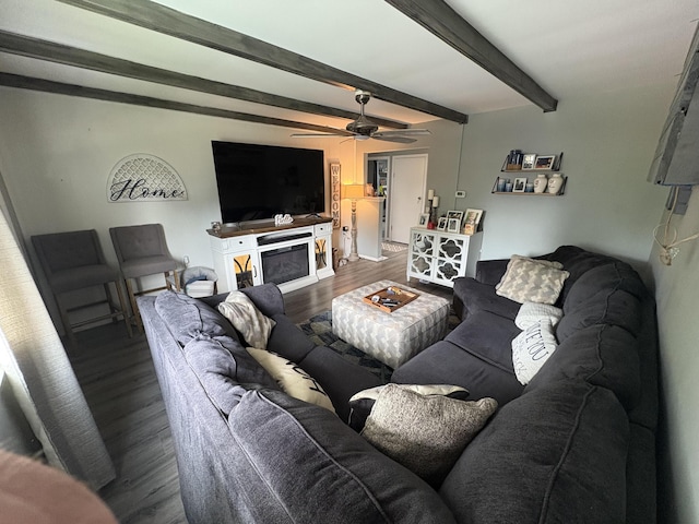 107 W 1st St, Silver Grove, KY 41085 - living room with wood finished floors, beam ceiling, a ceiling fan, and a glass covered fireplace