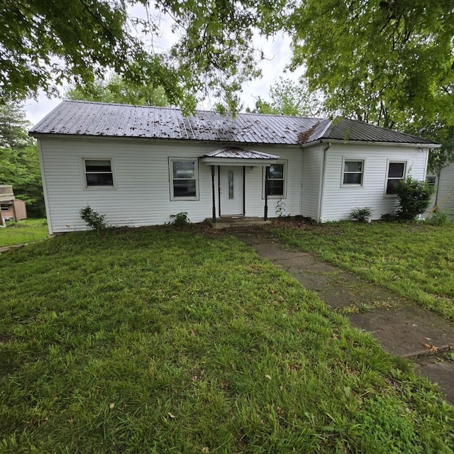 106 Roland Ave, Owenton, KY 40359 - ranch-style home featuring a front yard and metal roof