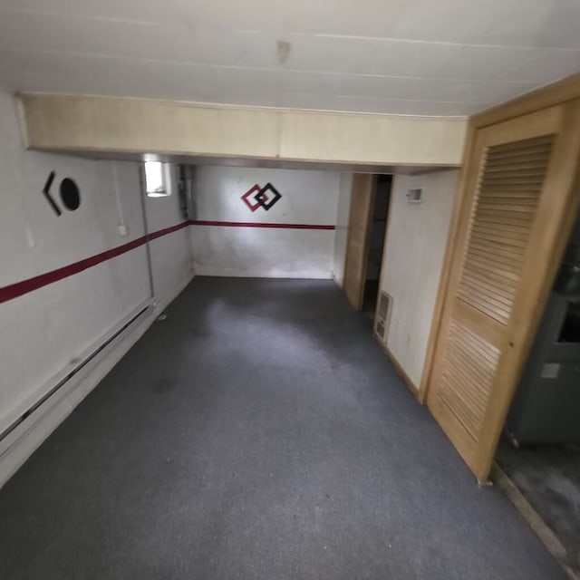 106 Roland Ave, Owenton, KY 40359 - finished basement featuring a baseboard radiator and dark colored carpet