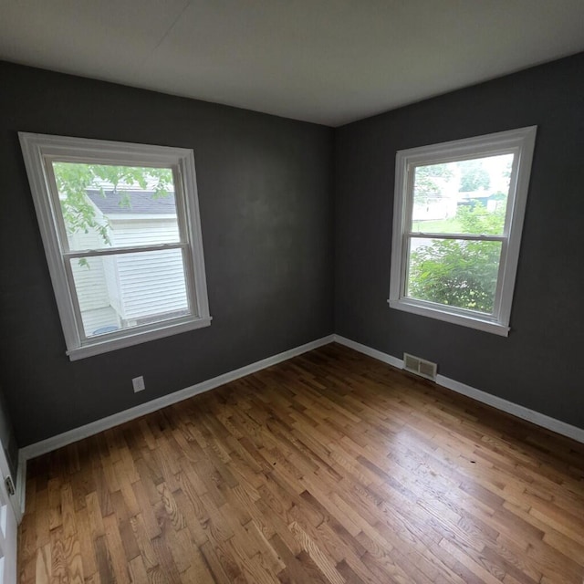 106 Roland Ave, Owenton, KY 40359 - unfurnished room featuring healthy amount of natural light, wood finished floors, and baseboards
