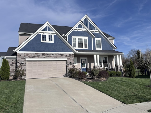 13014 Borel Ct, Union, KY 41091 - craftsman-style house featuring a porch, driveway, a front yard, an attached garage, and stone siding