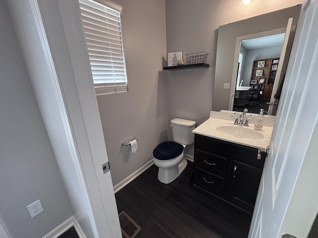 13014 Borel Ct, Union, KY 41091 - bathroom with toilet, baseboards, vanity, and wood finished floors