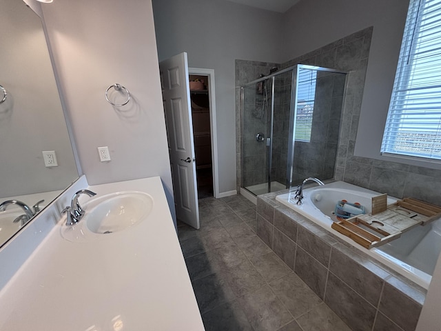 13014 Borel Ct, Union, KY 41091 - bathroom featuring a garden tub, a stall shower, a spacious closet, tile patterned flooring, and vanity