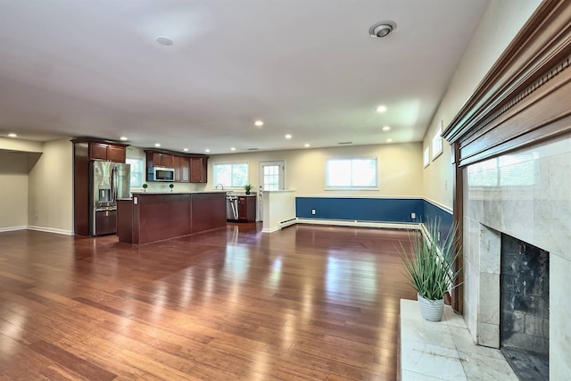 724 Dudley Rd, Edgewood, KY 41017 - unfurnished living room featuring dark wood-style floors, recessed lighting, a fireplace, and baseboard heating
