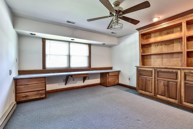 724 Dudley Rd, Edgewood, KY 41017 - unfurnished office featuring a baseboard radiator, built in desk, a ceiling fan, and light carpet