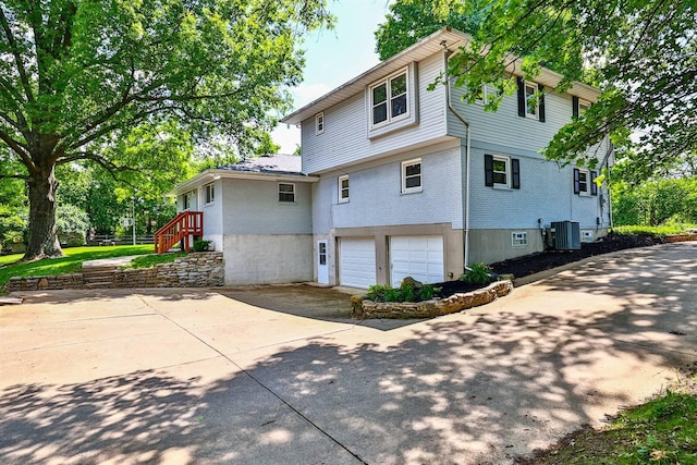 724 Dudley Rd, Edgewood, KY 41017 - rear view of house with brick siding, an attached garage, and concrete driveway