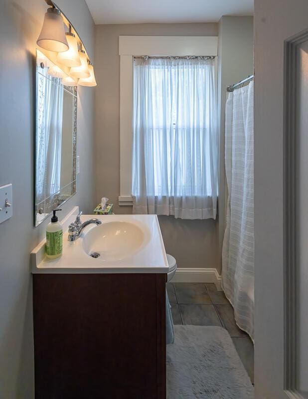 386 Linden Ave, Southgate, KY 41071 - full bathroom featuring vanity, tile patterned floors, and curtained shower