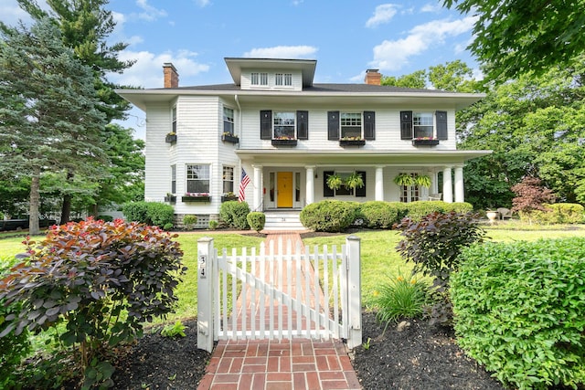 34 Ridge Rd, Fort Mitchell, KY 41011 - traditional style home featuring a chimney, a gate, covered porch, and a front yard