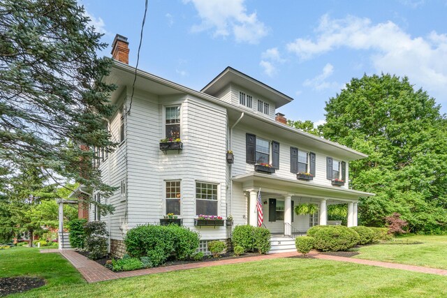34 Ridge Rd, Fort Mitchell, KY 41011 - american foursquare style home featuring a chimney, covered porch, and a front lawn