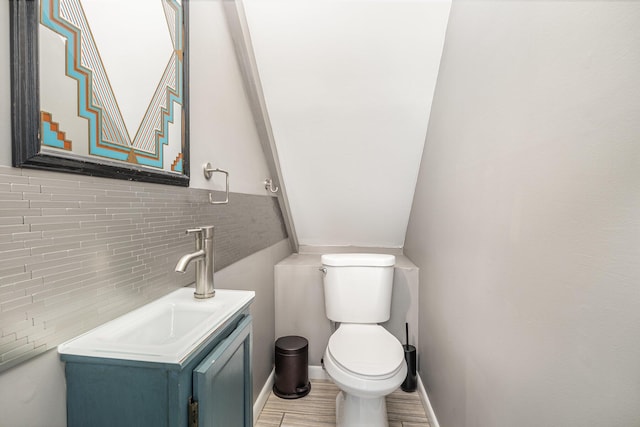 2003 Pieck Dr, Fort Wright, KY 41011 - bathroom with vanity, backsplash, and wood finished floors