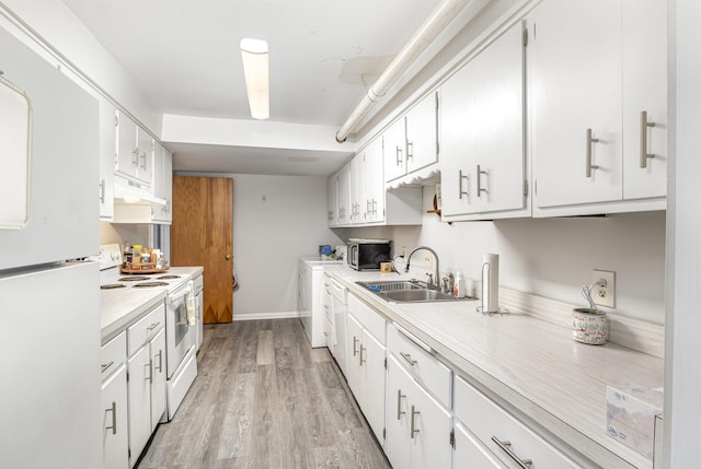 2003 Pieck Dr, Fort Wright, KY 41011 - kitchen featuring white appliances, under cabinet range hood, light countertops, light wood-style floors, and washer / clothes dryer