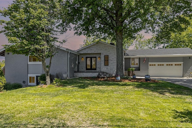 2003 Pieck Dr, Fort Wright, KY 41011 - view of front of home with an attached garage, a front lawn, and concrete driveway