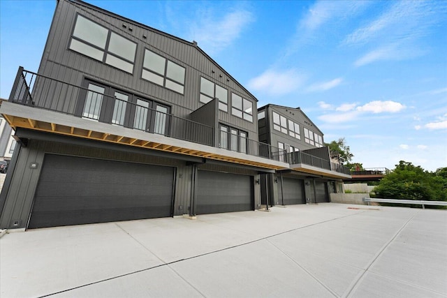 95 W 13th St Unit 11, Newport, KY 41071 - view of front facade with a balcony, an attached garage, and driveway