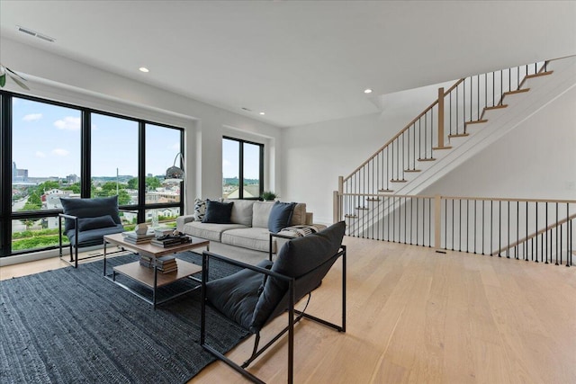 76 W 13th St Unit 34, Newport, KY 41071 - living room with light wood-type flooring, recessed lighting, and stairs