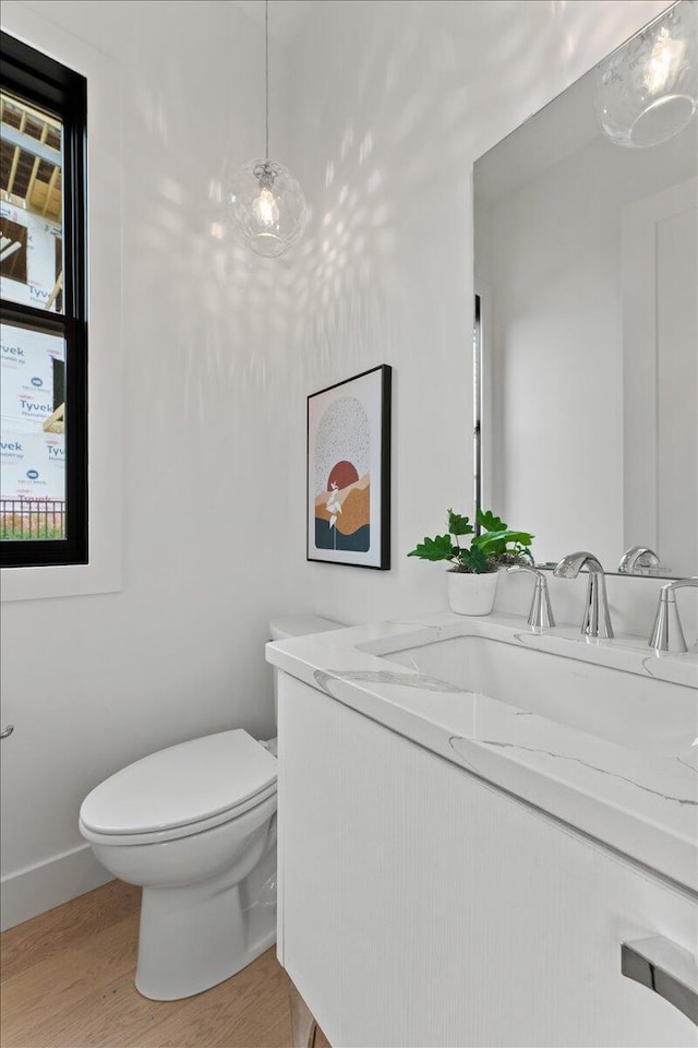 76 W 13th St Unit 34, Newport, KY 41071 - half bathroom with vanity and wood finished floors