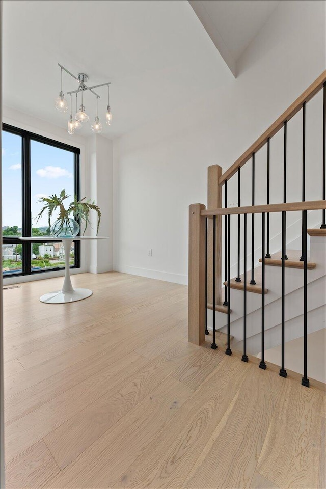 76 W 13th St Unit 34, Newport, KY 41071 - stairway with a chandelier and wood finished floors