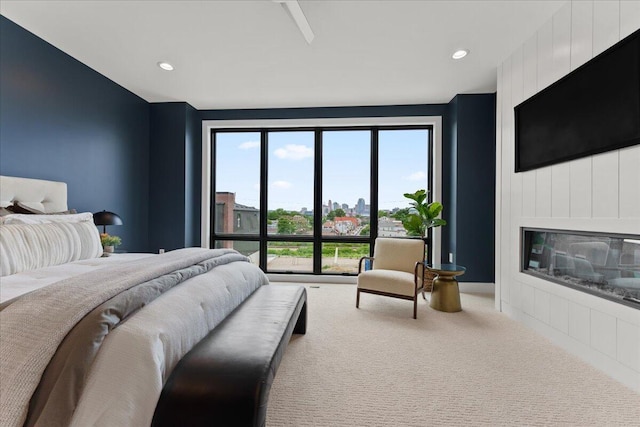 76 W 13th St Unit 34, Newport, KY 41071 - bedroom featuring carpet floors, multiple windows, a large fireplace, and recessed lighting