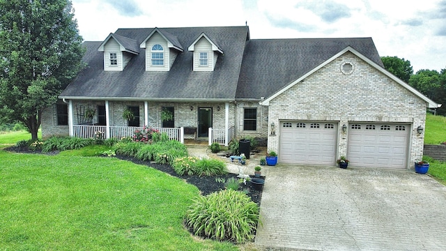 3745 Sweet Owen Rd, Owenton, KY 40359 - cape cod home featuring driveway, a garage, a porch, and brick siding