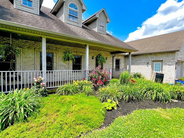 3745 Sweet Owen Rd, Owenton, KY 40359 - property entrance featuring covered porch, brick siding, and a shingled roof