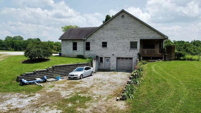 3745 Sweet Owen Rd, Owenton, KY 40359 - view of side of property with brick siding, dirt driveway, a lawn, and an attached garage