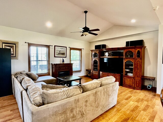 3745 Sweet Owen Rd, Owenton, KY 40359 - living room featuring a ceiling fan, vaulted ceiling, light wood-style flooring, and a fireplace