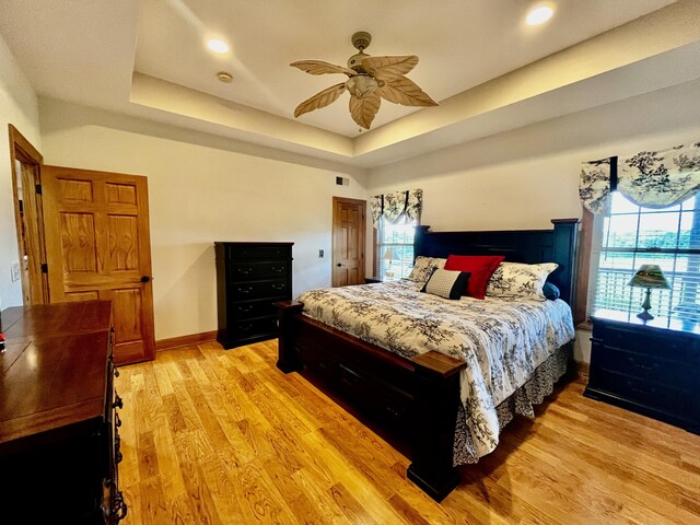 3745 Sweet Owen Rd, Owenton, KY 40359 - bedroom featuring multiple windows, light wood-style floors, a raised ceiling, recessed lighting, and ceiling fan