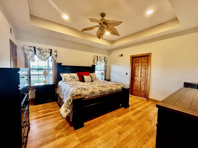 3745 Sweet Owen Rd, Owenton, KY 40359 - bedroom featuring a raised ceiling, light wood-type flooring, recessed lighting, and ceiling fan
