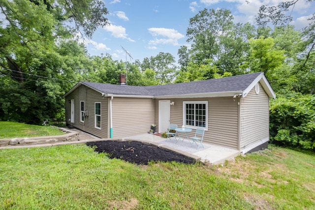 12077 Vises Trl, Covington, KY 41015 - view of front facade featuring a patio, a front yard, and roof with shingles