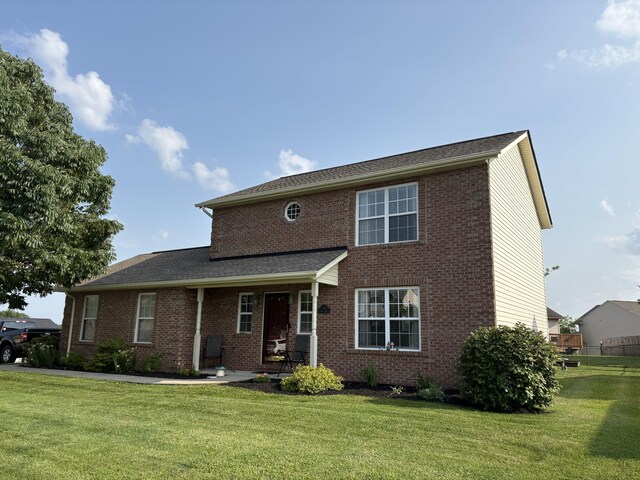 301 Fairway Dr, Dry Ridge, KY 41035 - traditional-style home featuring a front yard and brick siding