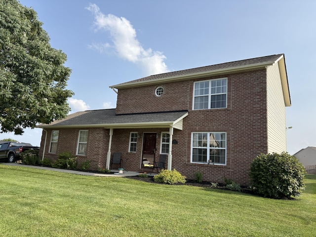 301 Fairway Dr, Dry Ridge, KY 41035 - traditional-style house featuring a front yard and brick siding