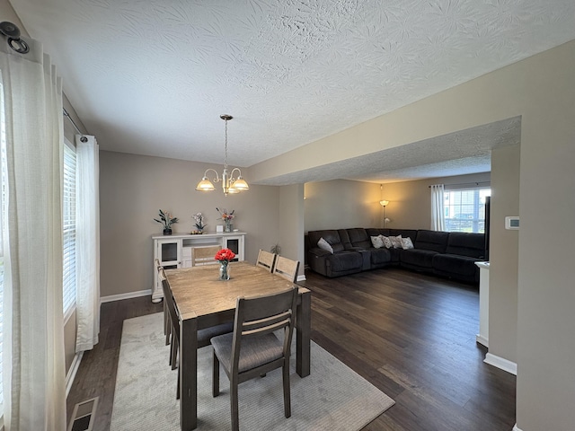 301 Fairway Dr, Dry Ridge, KY 41035 - dining space with a textured ceiling, dark wood-style flooring, and a chandelier