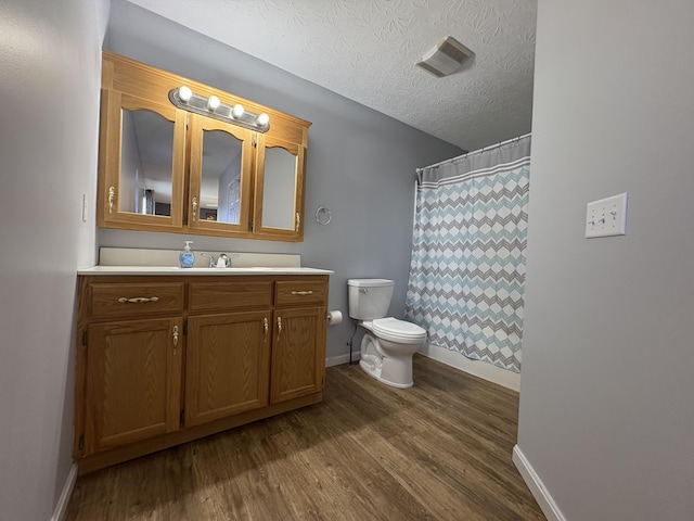 301 Fairway Dr, Dry Ridge, KY 41035 - full bathroom featuring wood finished floors, vanity, a textured ceiling, and a shower with curtain