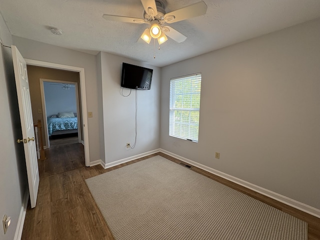 301 Fairway Dr, Dry Ridge, KY 41035 - unfurnished bedroom with dark wood-style floors and ceiling fan