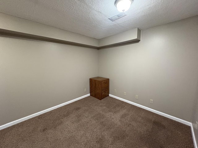 301 Fairway Dr, Dry Ridge, KY 41035 - spare room featuring dark carpet and a textured ceiling