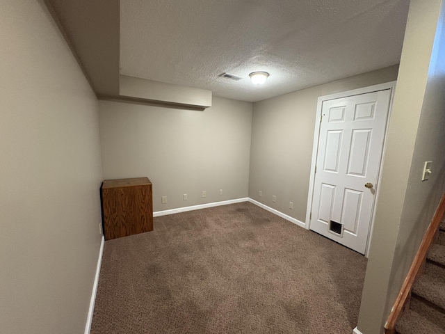 301 Fairway Dr, Dry Ridge, KY 41035 - finished below grade area with dark carpet and a textured ceiling