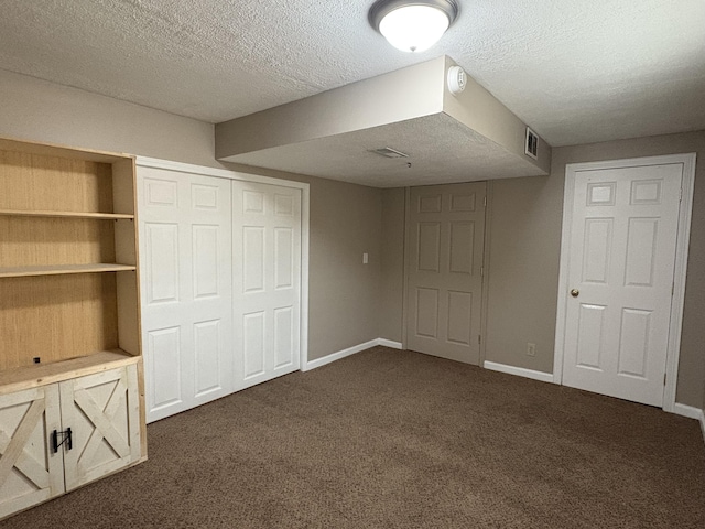301 Fairway Dr, Dry Ridge, KY 41035 - unfurnished bedroom featuring a closet, dark carpet, and a textured ceiling