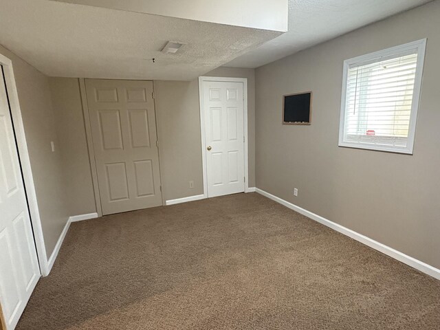 301 Fairway Dr, Dry Ridge, KY 41035 - unfurnished bedroom with dark colored carpet and a textured ceiling