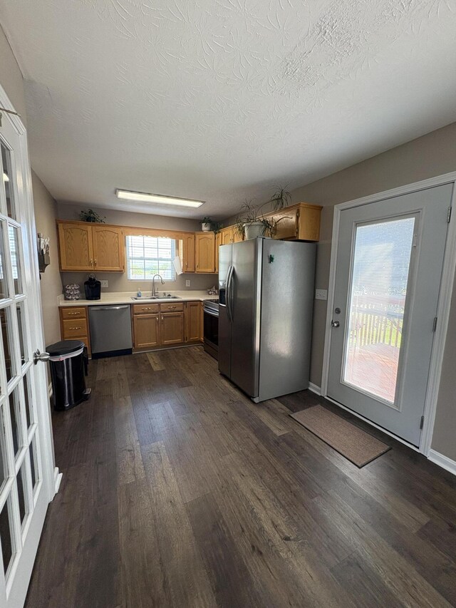 301 Fairway Dr, Dry Ridge, KY 41035 - kitchen featuring stainless steel appliances, dark wood-style floors, light countertops, and a textured ceiling